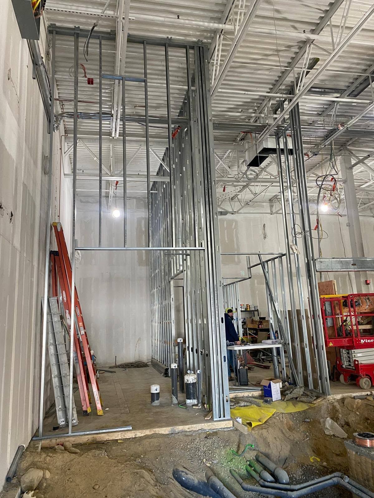 Tall metal stud framing going up inside the children's swim center in Manchester, NH